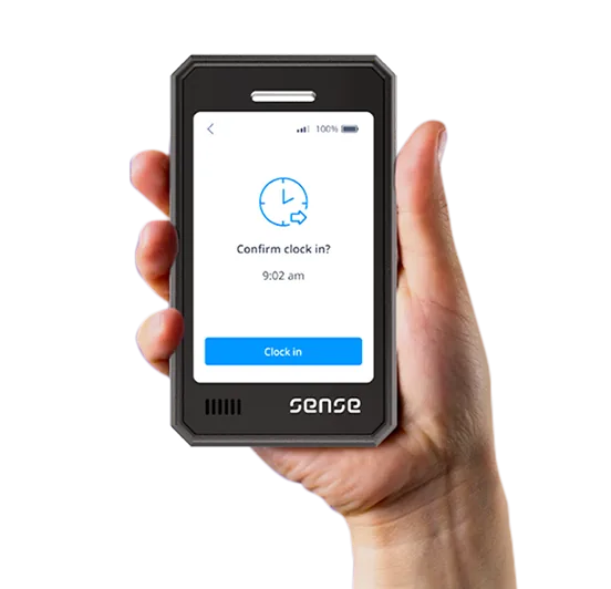 Sense clock-in badge held in a hand, showing a clock-in confirmation screen